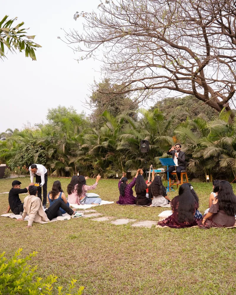 Guests gathered together on a lawn for an outdoor session