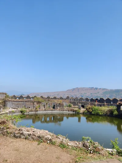 Coastal fort and landscape near Alibaug under a clear sky